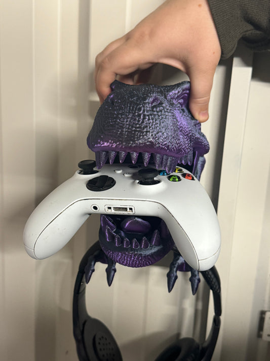 Wall mount dinosaur head holds head phones and Xbox remote/playstation remote